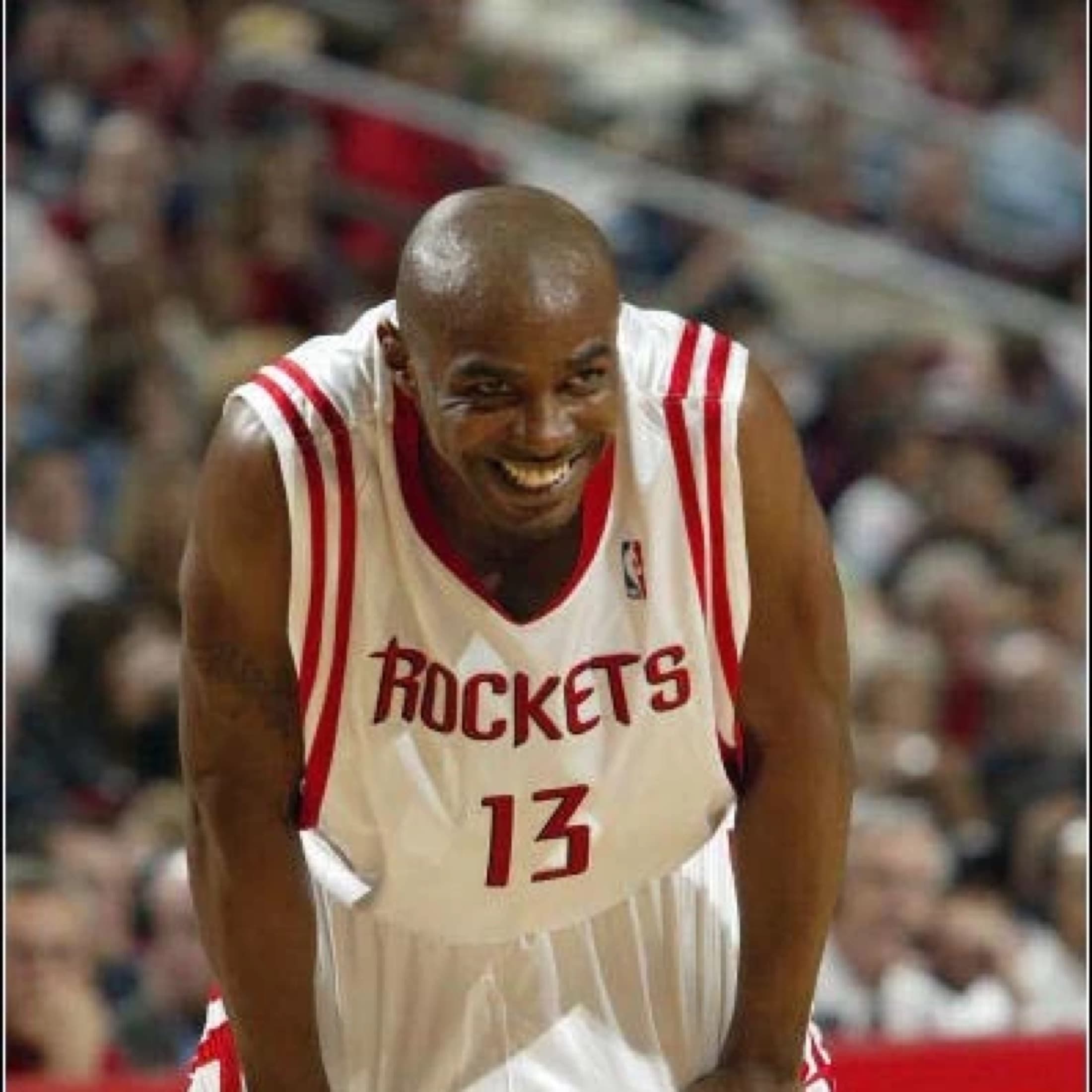 Mike James smiling in a Houston Rockets jersey.